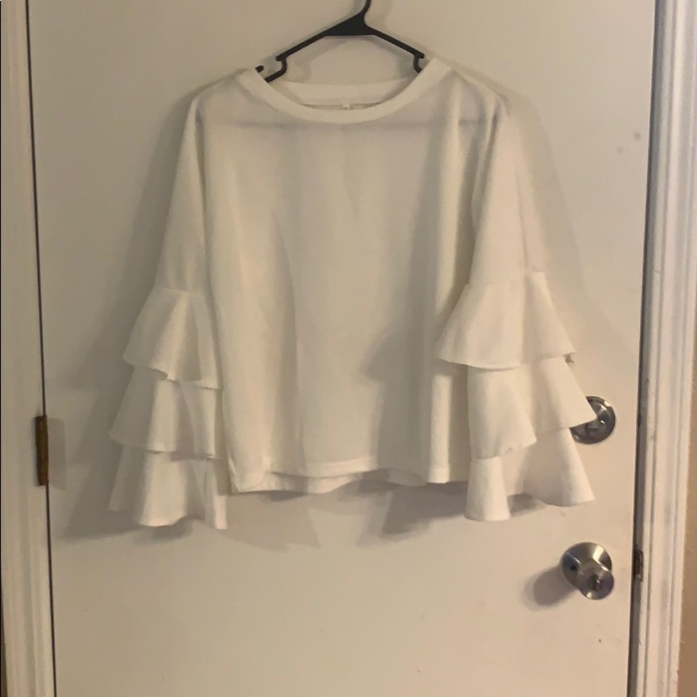 White ruffle shirt